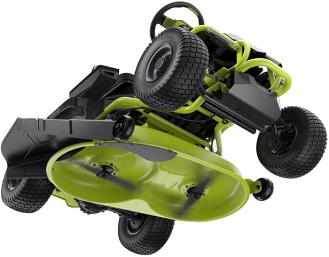 Ryobi electric riding lawn mower with a 38-inch deck and rear engine, shown cutting grass in a lush backyard.