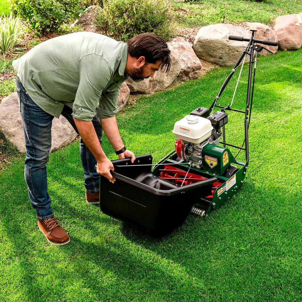 Pillowle Classic Standard 20-inch 7-blade gas walk-behind lawn mower with a metal deck and adjustable handle in a yard setting.