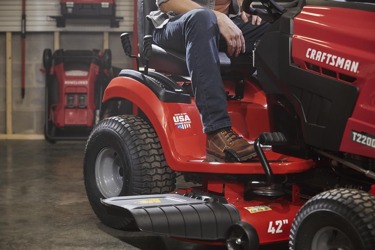 Pillowle CRAFTSMAN T2200K riding lawn mower with 42-inch deck and 20 HP hydrostatic engine on a lawn.