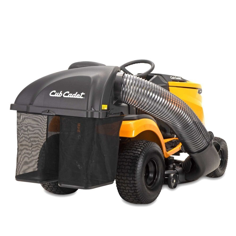 Cub Cadet double bagger attachment for XT1 and XT2 series riding mowers, shown attached to a lawn mower in a yard.