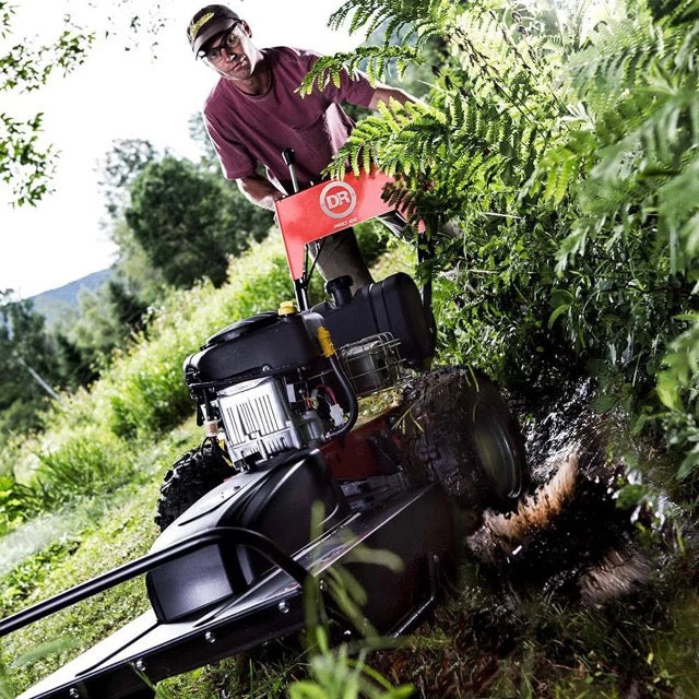 Pillowle DR Power Pro brush mower with 15.5 HP engine, showing the rugged lawn mower with cutting deck and sturdy build.