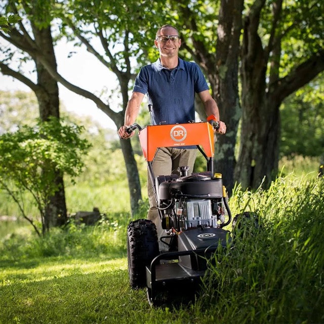 Pillowle DR Power Pro Brush Mower with 15.5 HP engine, featuring heavy-duty blades for clearing thick brush and dense grass.