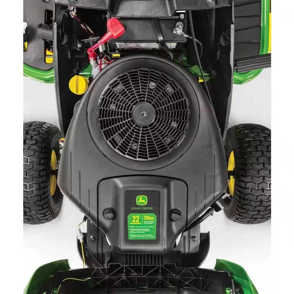 John Deere S100 riding lawn mower with 17.5 HP gas engine and hydrostatic drive, shown in a yard setting.