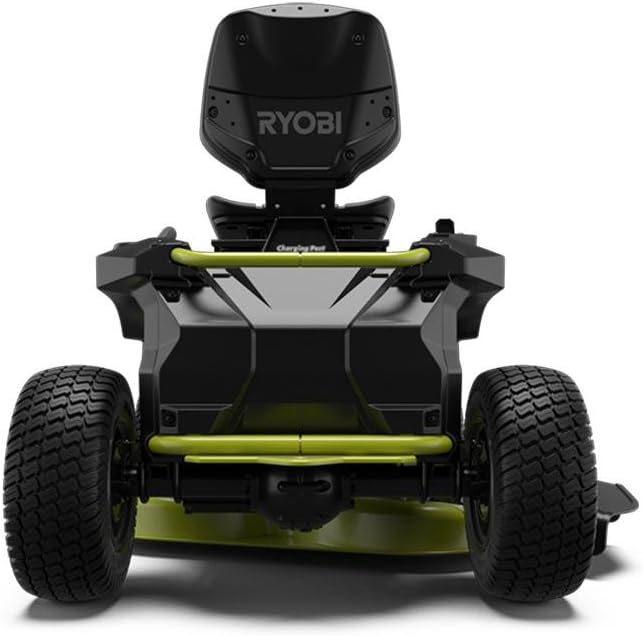 Ryobi electric riding lawn mower with a 38-inch cutting deck and rear engine, shown on a grassy lawn.